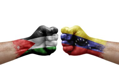 Two hands punch to each others on white background. Country flags painted fists, conflict crisis concept between jordan and venezuela