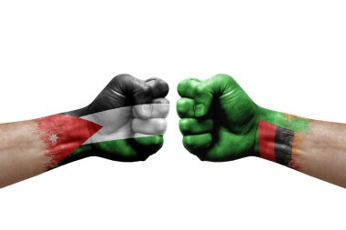 Two hands punch to each others on white background. Country flags painted fists, conflict crisis concept between jordan and zambia