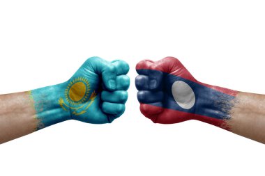 Two hands punch to each others on white background. Country flags painted fists, conflict crisis concept between kazakhstan and laos