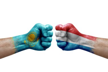 Two hands punch to each others on white background. Country flags painted fists, conflict crisis concept between kazakhstan and luxembourg