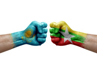 Two hands punch to each others on white background. Country flags painted fists, conflict crisis concept between kazakhstan and myanmar