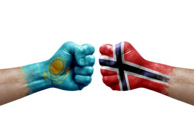 Two hands punch to each others on white background. Country flags painted fists, conflict crisis concept between kazakhstan and norway