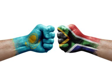 Two hands punch to each others on white background. Country flags painted fists, conflict crisis concept between kazakhstan and south africa