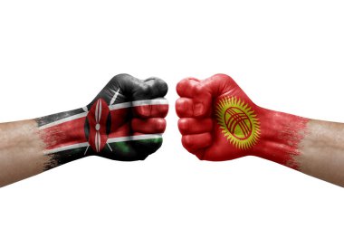 Two hands punch to each others on white background. Country flags painted fists, conflict crisis concept between kenya and kyrgyzstan