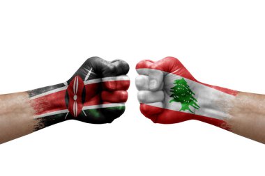 Two hands punch to each others on white background. Country flags painted fists, conflict crisis concept between kenya and lebanon