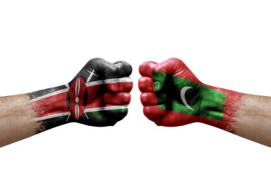 Two hands punch to each others on white background. Country flags painted fists, conflict crisis concept between kenya and maldives