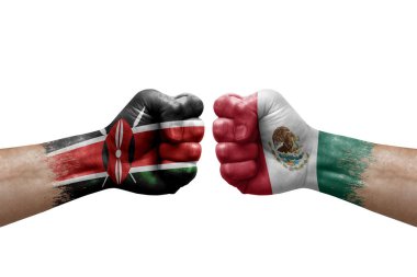 Two hands punch to each others on white background. Country flags painted fists, conflict crisis concept between kenya and mexico