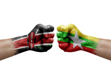 Two hands punch to each others on white background. Country flags painted fists, conflict crisis concept between kenya and myanmar