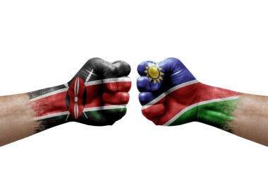 Two hands punch to each others on white background. Country flags painted fists, conflict crisis concept between kenya and namibia
