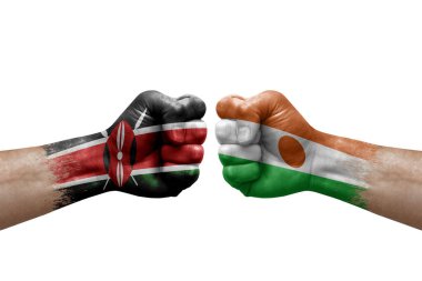 Two hands punch to each others on white background. Country flags painted fists, conflict crisis concept between kenya and niger