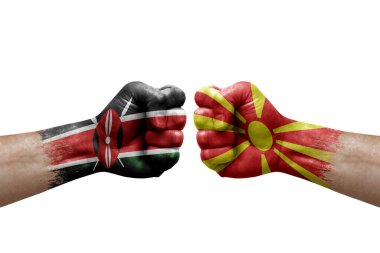 Two hands punch to each others on white background. Country flags painted fists, conflict crisis concept between kenya and north macedonia