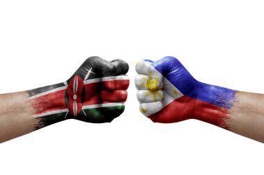 Two hands punch to each others on white background. Country flags painted fists, conflict crisis concept between kenya and philippines