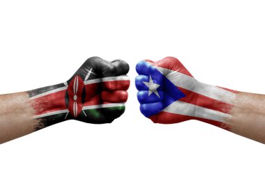 Two hands punch to each others on white background. Country flags painted fists, conflict crisis concept between kenya and puerto rico