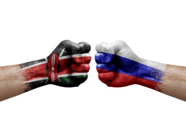 Two hands punch to each others on white background. Country flags painted fists, conflict crisis concept between kenya and russia