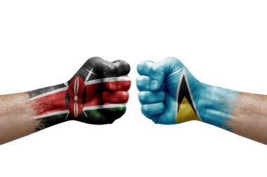 Two hands punch to each others on white background. Country flags painted fists, conflict crisis concept between kenya and saint lucia
