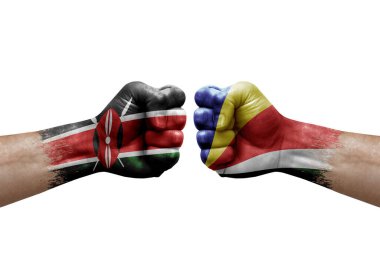Two hands punch to each others on white background. Country flags painted fists, conflict crisis concept between kenya and seychelles