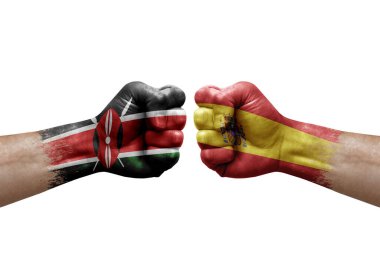 Two hands punch to each others on white background. Country flags painted fists, conflict crisis concept between kenya and spain
