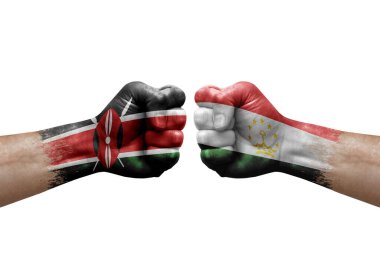 Two hands punch to each others on white background. Country flags painted fists, conflict crisis concept between kenya and tajikistan