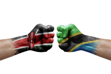 Two hands punch to each others on white background. Country flags painted fists, conflict crisis concept between kenya and tanzania