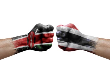 Two hands punch to each others on white background. Country flags painted fists, conflict crisis concept between kenya and thailand