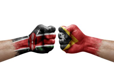 Two hands punch to each others on white background. Country flags painted fists, conflict crisis concept between kenya and timor leste