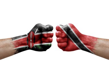 Two hands punch to each others on white background. Country flags painted fists, conflict crisis concept between kenya and tobago