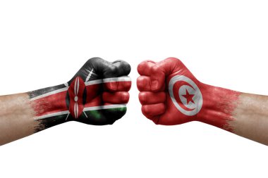 Two hands punch to each others on white background. Country flags painted fists, conflict crisis concept between kenya and tunisia