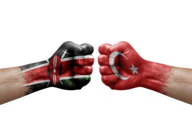 Two hands punch to each others on white background. Country flags painted fists, conflict crisis concept between kenya and turkey