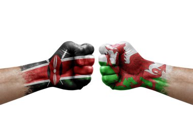 Two hands punch to each others on white background. Country flags painted fists, conflict crisis concept between kenya and wales