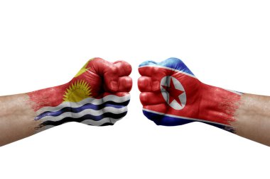 Two hands punch to each others on white background. Country flags painted fists, conflict crisis concept between kiribati and north korea