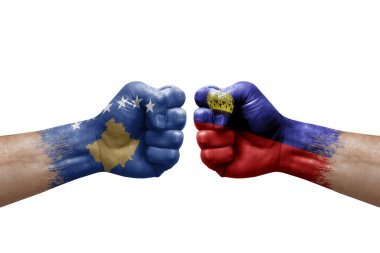 Two hands punch to each others on white background. Country flags painted fists, conflict crisis concept between kosovo and liechtenstein