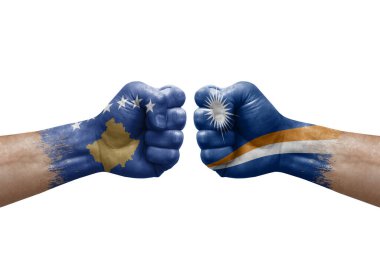 Two hands punch to each others on white background. Country flags painted fists, conflict crisis concept between kosovo and marshall islands