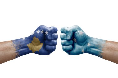 Two hands punch to each others on white background. Country flags painted fists, conflict crisis concept between kosovo and micronesia