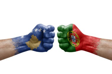 Two hands punch to each others on white background. Country flags painted fists, conflict crisis concept between kosovo and portugal