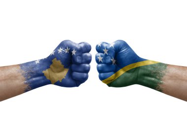 Two hands punch to each others on white background. Country flags painted fists, conflict crisis concept between kosovo and solomon islands