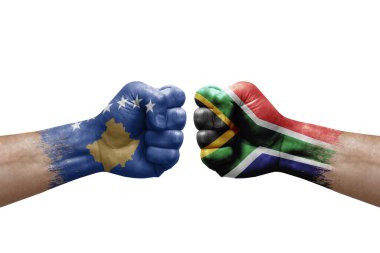 Two hands punch to each others on white background. Country flags painted fists, conflict crisis concept between kosovo and south africa
