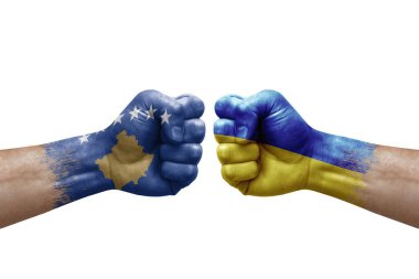 Two hands punch to each others on white background. Country flags painted fists, conflict crisis concept between kosovo and ukraine