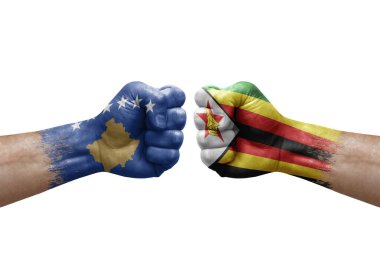 Two hands punch to each others on white background. Country flags painted fists, conflict crisis concept between kosovo and zimbabwe
