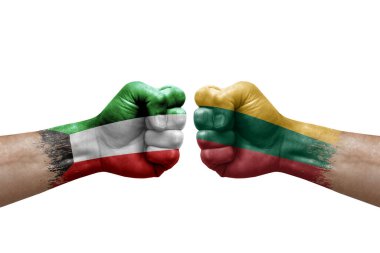 Two hands punch to each others on white background. Country flags painted fists, conflict crisis concept between kuwait and lithuania