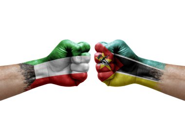 Two hands punch to each others on white background. Country flags painted fists, conflict crisis concept between kuwait and mozambique