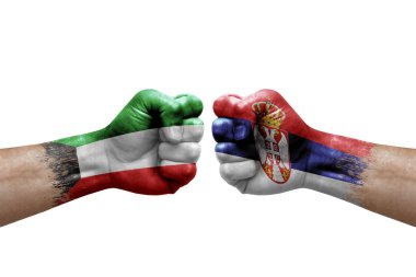 Two hands punch to each others on white background. Country flags painted fists, conflict crisis concept between kuwait and serbia