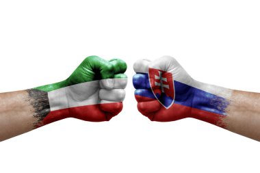 Two hands punch to each others on white background. Country flags painted fists, conflict crisis concept between kuwait and slovakia