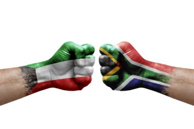 Two hands punch to each others on white background. Country flags painted fists, conflict crisis concept between kuwait and south africa