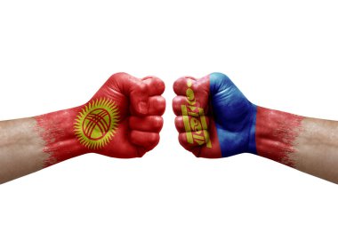 Two hands punch to each others on white background. Country flags painted fists, conflict crisis concept between kyrgyzstan and mongolia
