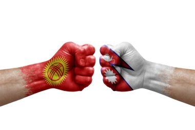 Two hands punch to each others on white background. Country flags painted fists, conflict crisis concept between kyrgyzstan and nepal