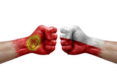 Two hands punch to each others on white background. Country flags painted fists, conflict crisis concept between kyrgyzstan and poland