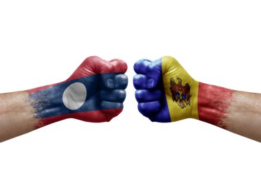 Two hands punch to each others on white background. Country flags painted fists, conflict crisis concept between laos and moldova