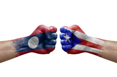 Two hands punch to each others on white background. Country flags painted fists, conflict crisis concept between laos and puerto rico
