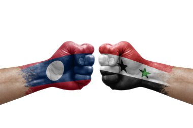 Two hands punch to each others on white background. Country flags painted fists, conflict crisis concept between laos and syria