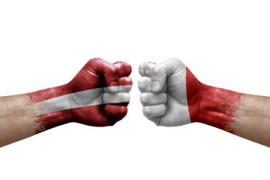Two hands punch to each others on white background. Country flags painted fists, conflict crisis concept between latvia and malta